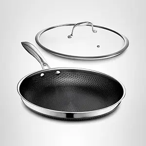 HexClad hybrid pan with hexagonal pattern cooking Chilean sea bass without sticking